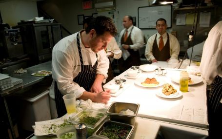 scott in his kitchen chopping ingredients  